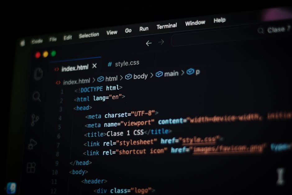A close-up screenshot of a computer screen displaying HTML code for a website, including tags such as <!DOCTYPE html>, <html>, <head>, <title>, and <link>. The interface shows a dark background with c